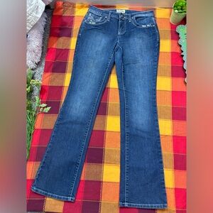 Cowgirls Mid rise boot cut jeans